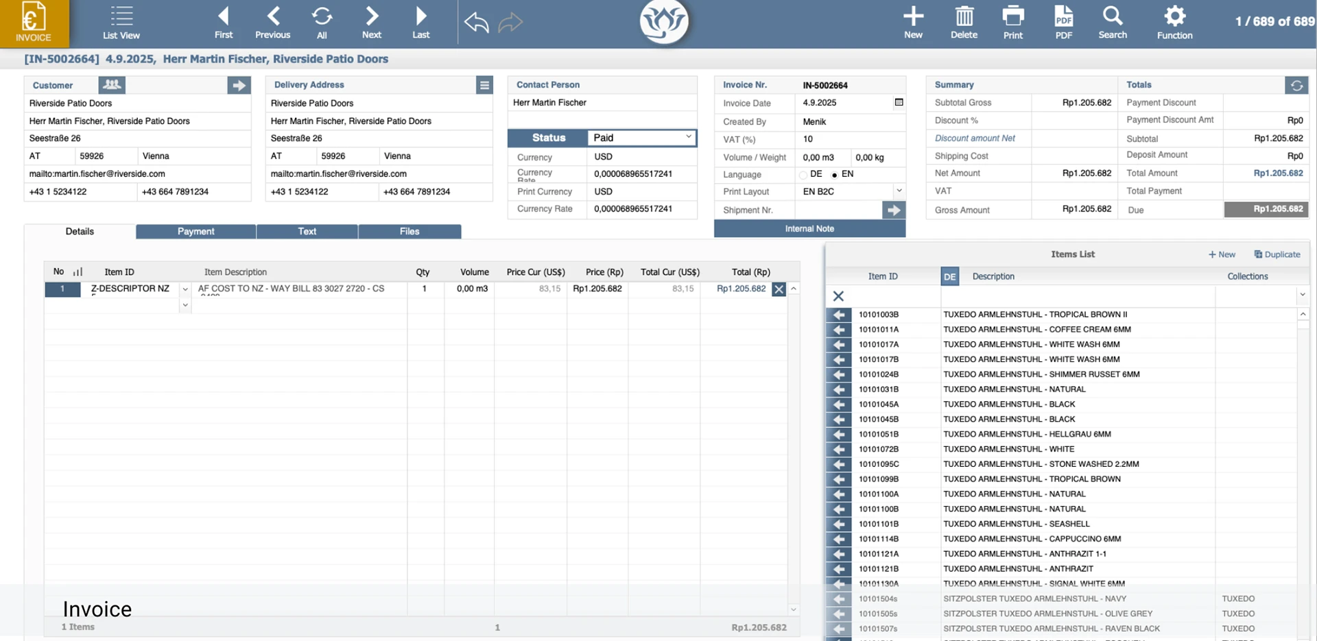 BLOOM invoice screen with payment status, currency and totals