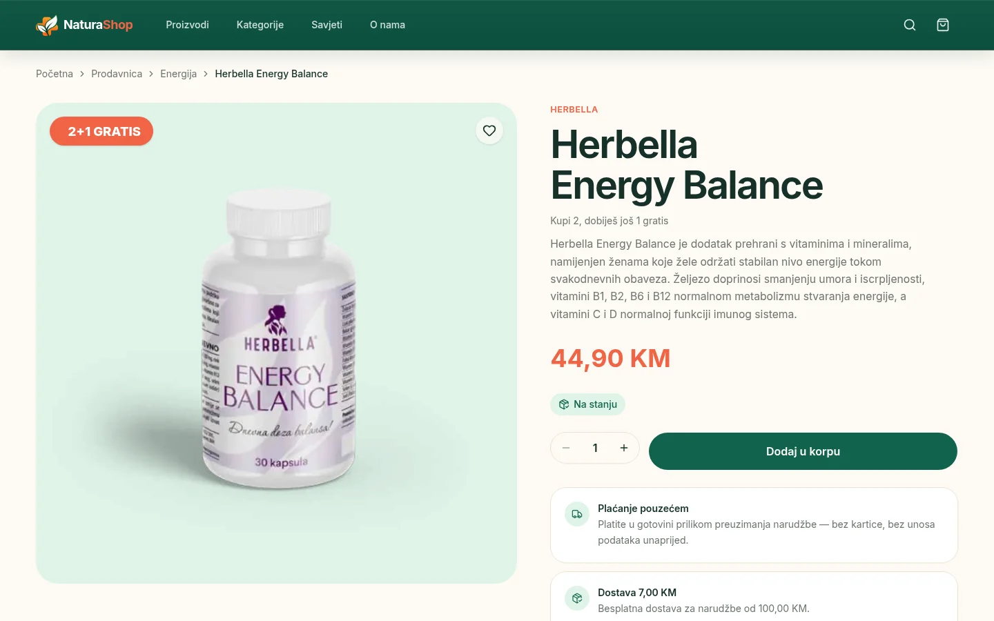 NaturaShop product page for a dietary supplement with a large product photo, a 2+1 GRATIS badge, the brand and name, a short description, the price, an in-stock label, a quantity selector and an add-to-cart button